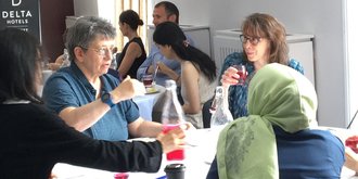 Women at a research meeting