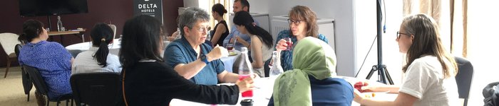 Women at a research meeting