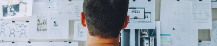 man at noticeboard