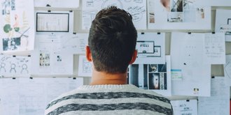 man at noticeboard