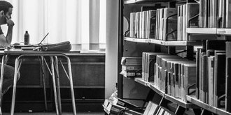 man sitting in library
